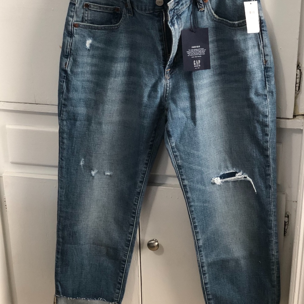Mid-rise rip and repair girlfriend jeans